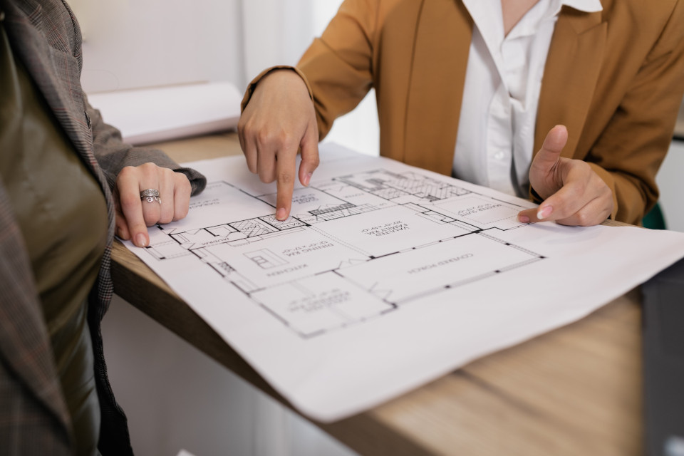 two people discussing construction plans